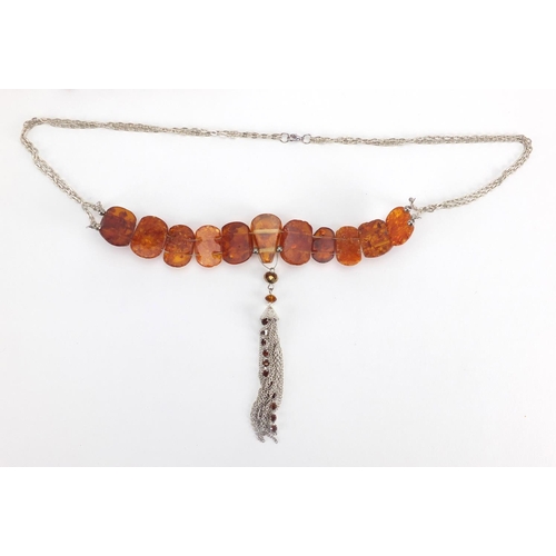 783 - Two natural amber coloured necklaces and a cheroot, approximate weight 88.0g