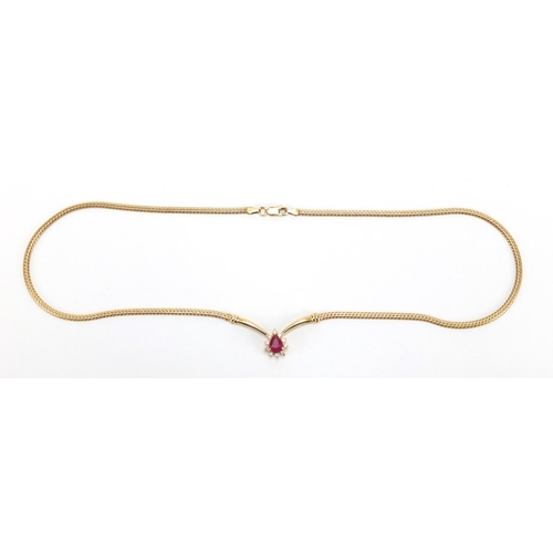 719 - 14ct gold tear drop ruby and diamond necklace, 24cm in length, housed in a Christian Bernard of Pari... 