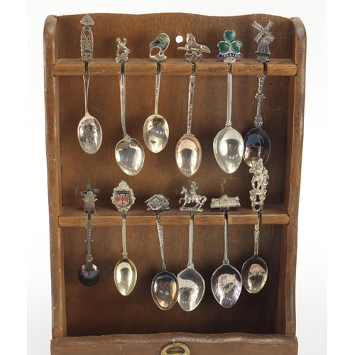 532 - Collection of silver plated souvenir teaspoons, with two display stands