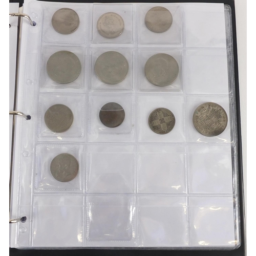 627 - Album of World coins including silver three penny bits and Chinese examples