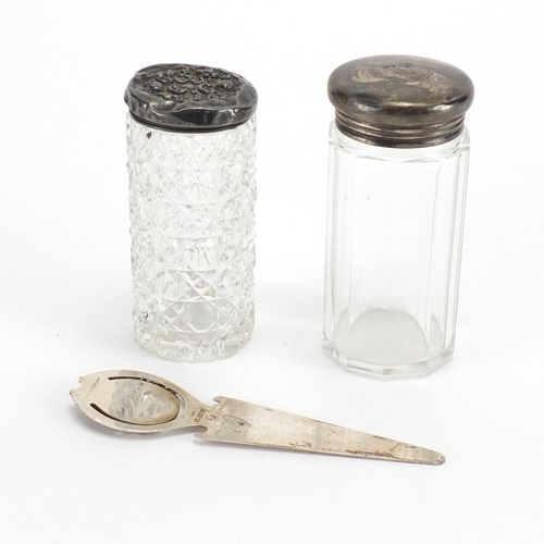 537 - Silver page marker with enamelled crest and two cut glass bottles with silver lids, the largest 8.5c... 