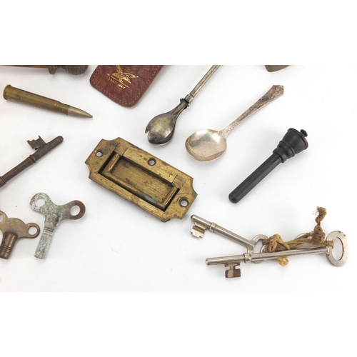 555 - Group of antique and later keys, locks and clock pendulums