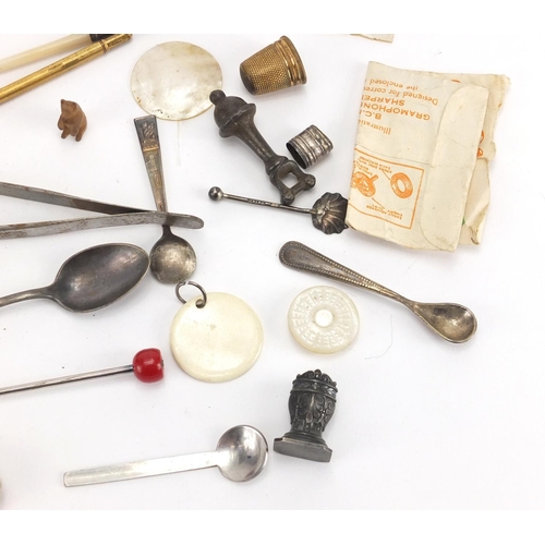 546 - Bag of objects including Georgian and later silver spoons, Mother of Pearl counters and thimbles