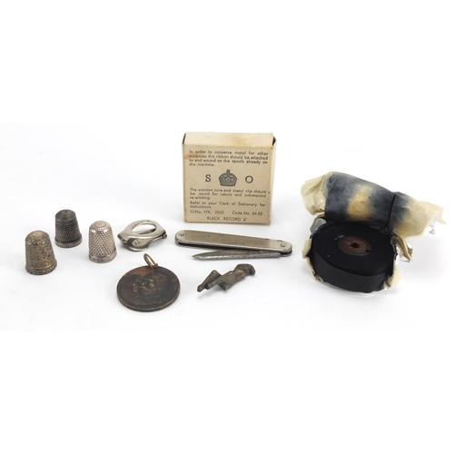 534 - Bag of objects including silver thimbles, a Military issue ink ribbon and an Edmunds Walker & Co poc... 