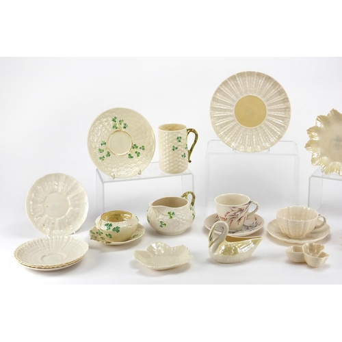 525 - Collection of Belleek porcelain, some early examples including cups, saucers, jug and vases, the lar... 