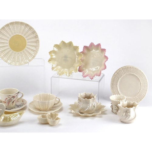 525 - Collection of Belleek porcelain, some early examples including cups, saucers, jug and vases, the lar... 