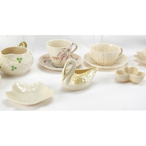 525 - Collection of Belleek porcelain, some early examples including cups, saucers, jug and vases, the lar... 