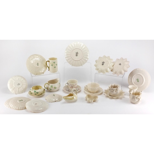 525 - Collection of Belleek porcelain, some early examples including cups, saucers, jug and vases, the lar... 