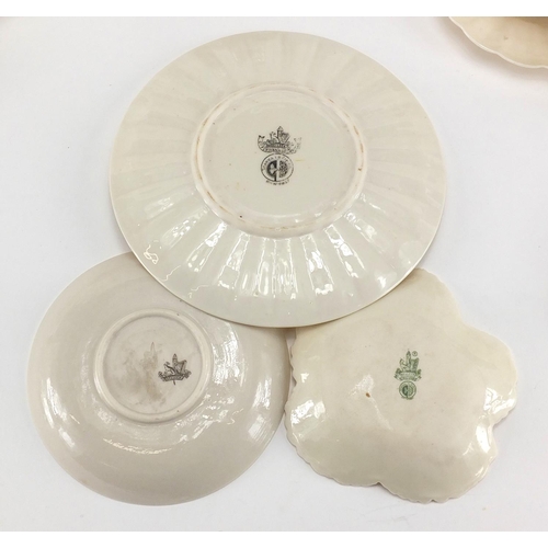 525 - Collection of Belleek porcelain, some early examples including cups, saucers, jug and vases, the lar... 