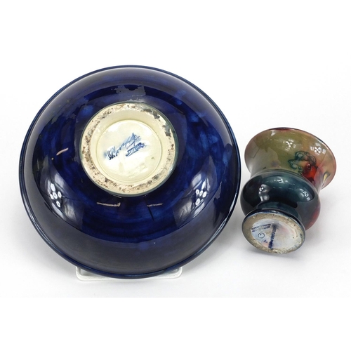 561 - Moorcroft pottery Hibiscus powder bowl and cover, together with a Moorcroft pottery Flambe urn vase,... 