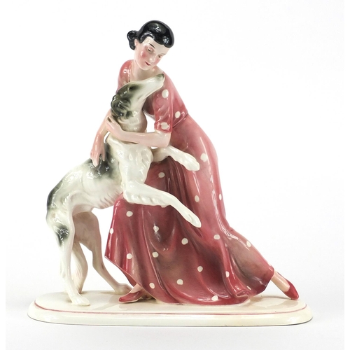 584 - Art Deco figurine of a girl and her dog by Katzhutte, factory marks to the base, 24.5cm high