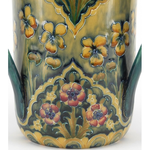 560 - Macintyre Moorcroft pottery tyg, hand painted and tube lined with flowers, factory marks and numbere... 