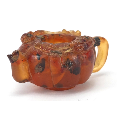 416 - Chinese natural amber teapot decorated with two water dragons, 10cm in length