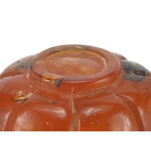 416 - Chinese natural amber teapot decorated with two water dragons, 10cm in length