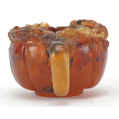 416 - Chinese natural amber teapot decorated with two water dragons, 10cm in length