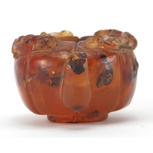 416 - Chinese natural amber teapot decorated with two water dragons, 10cm in length