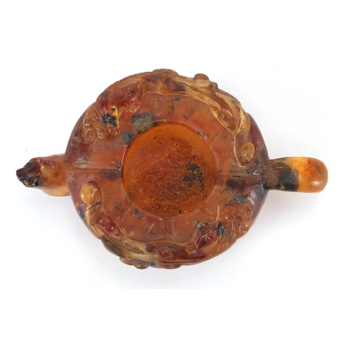 416 - Chinese natural amber teapot decorated with two water dragons, 10cm in length