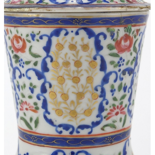 357 - Chinese porcelain strainer, hand painted in the famille rose palette with flowers, 20cm high