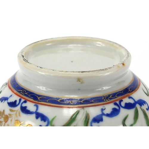 357 - Chinese porcelain strainer, hand painted in the famille rose palette with flowers, 20cm high