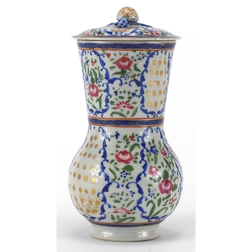 357 - Chinese porcelain strainer, hand painted in the famille rose palette with flowers, 20cm high