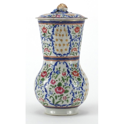 357 - Chinese porcelain strainer, hand painted in the famille rose palette with flowers, 20cm high