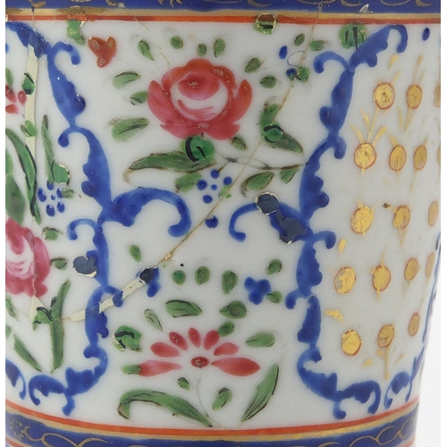 357 - Chinese porcelain strainer, hand painted in the famille rose palette with flowers, 20cm high