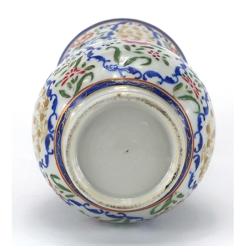 357 - Chinese porcelain strainer, hand painted in the famille rose palette with flowers, 20cm high