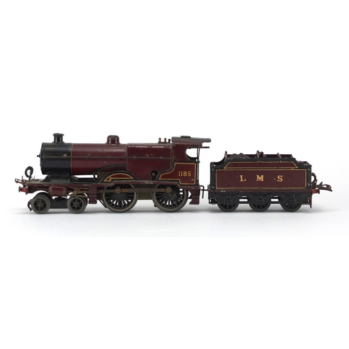 310 - Hornby O gauge clockwork LMS locomotive and tender, numbered 1185