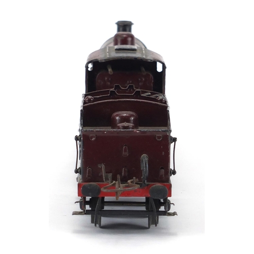 310 - Hornby O gauge clockwork LMS locomotive and tender, numbered 1185