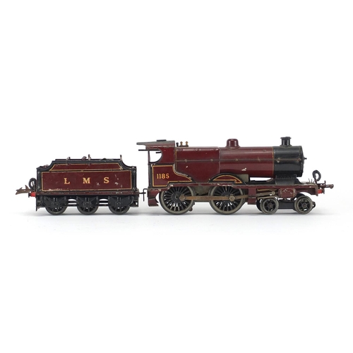 310 - Hornby O gauge clockwork LMS locomotive and tender, numbered 1185