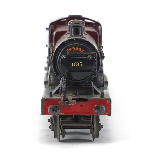 310 - Hornby O gauge clockwork LMS locomotive and tender, numbered 1185