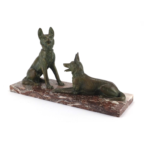 604 - Art Deco marble sculpture mounted with two bronzed German Shepherds, 52cm wide