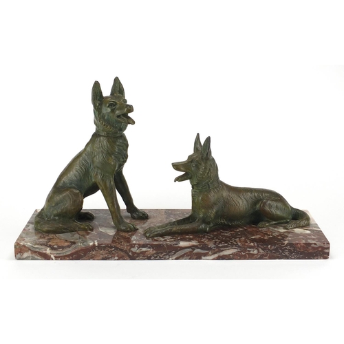 604 - Art Deco marble sculpture mounted with two bronzed German Shepherds, 52cm wide