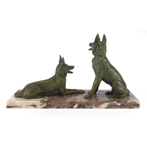 604 - Art Deco marble sculpture mounted with two bronzed German Shepherds, 52cm wide