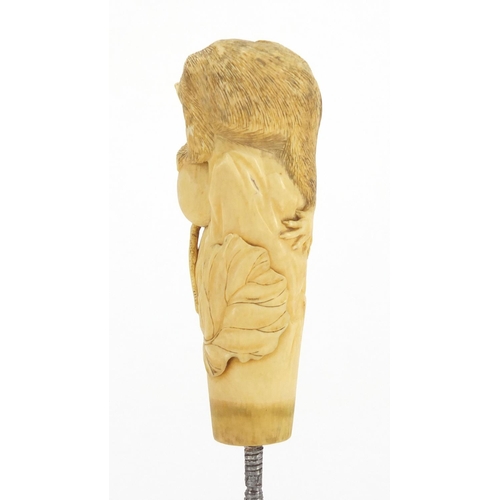 437 - Japanese ivory parasol handle, finely carved with a rat and snail, 13cm in length