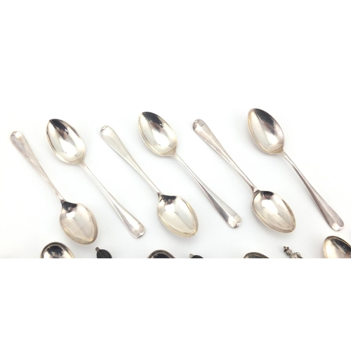 670 - Two sets of six silver spoons and a set of six unmarked silver teaspoons, various hallmarks, the lar... 