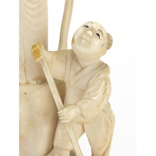 446 - Chinese ivory Okimono carved with a female and two children, red inset character marks to the base, ... 