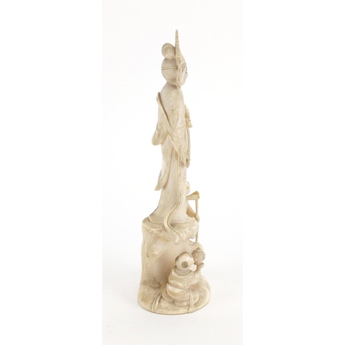 446 - Chinese ivory Okimono carved with a female and two children, red inset character marks to the base, ... 