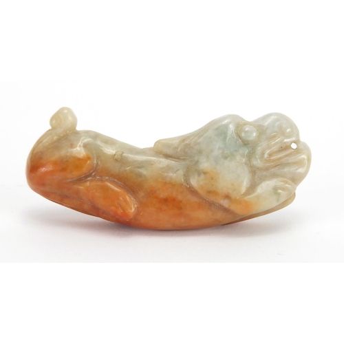 433 - Three Chinese russet and green jade pendants including a pair carved as mythical animals, with cords... 