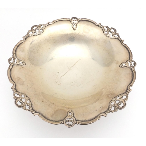 642 - Circular silver pedestal fruit bowl with stylised border, indistinct Birmingham hallmarks, 10cm high... 