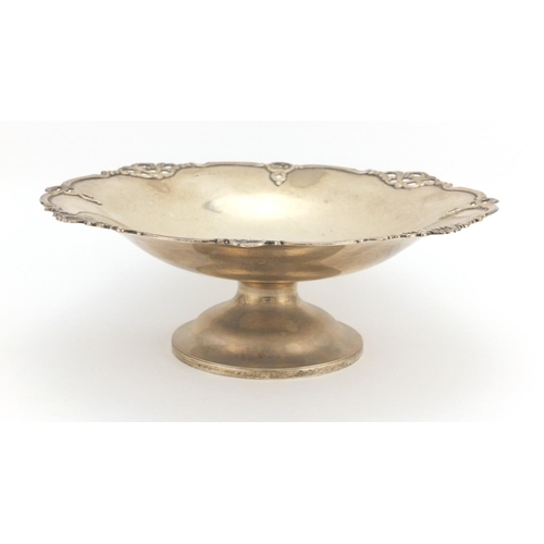 642 - Circular silver pedestal fruit bowl with stylised border, indistinct Birmingham hallmarks, 10cm high... 