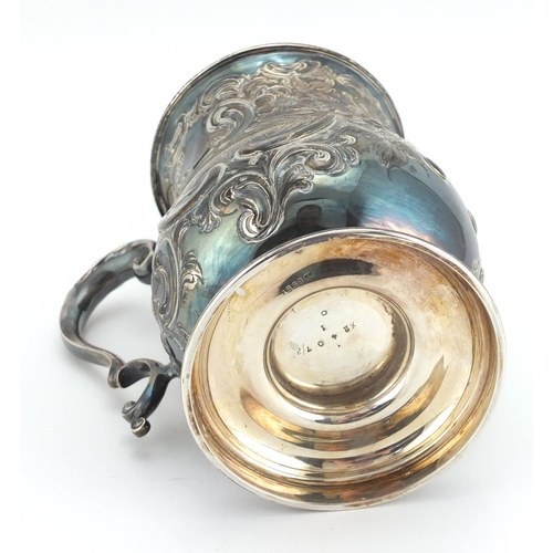 644 - Victorian silver tankard with embossed floral decoration, J.D & S Sheffield 1898, 13.5cm high, appro... 