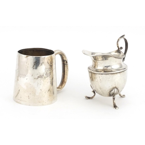 658 - Silver Christening tankard and three footed cream jug, various hallmarks, the largest 8.5cm high, ap... 