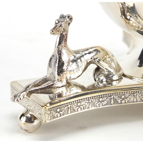 121 - Elkington & Co silver plated table lighter with triform base mounted with three greyhounds, impresse... 