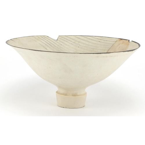 589 - David Howard Jones Raku footed bowl with flared rim, incised initials around the foot rim, 20.5cm in... 