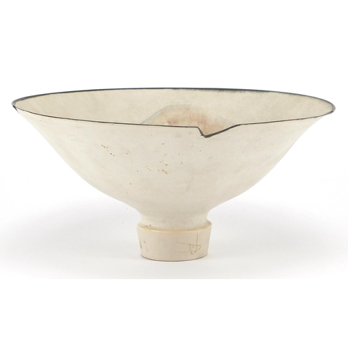 589 - David Howard Jones Raku footed bowl with flared rim, incised initials around the foot rim, 20.5cm in... 