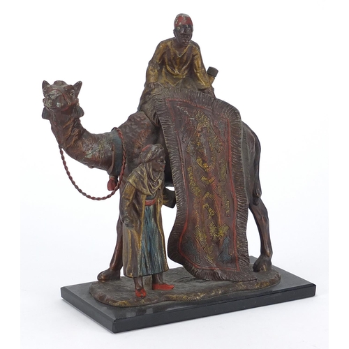 8 - Cold painted spelter table lighter in the form of a carpet seller on a camel, 19cm high