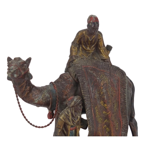 8 - Cold painted spelter table lighter in the form of a carpet seller on a camel, 19cm high