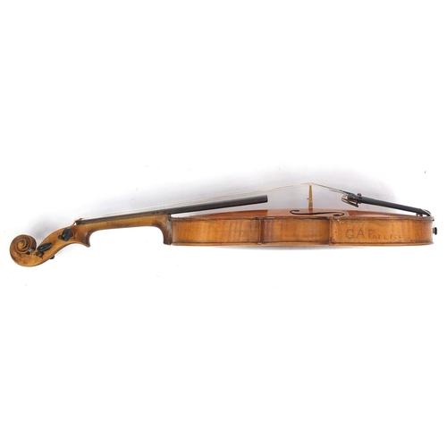 132 - Old wooden violin with scrolled neck, one piece back, two bows and fitted wooden carrying case, one ... 