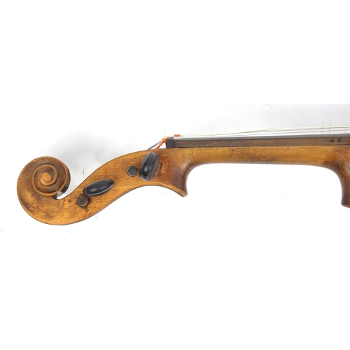 132 - Old wooden violin with scrolled neck, one piece back, two bows and fitted wooden carrying case, one ... 